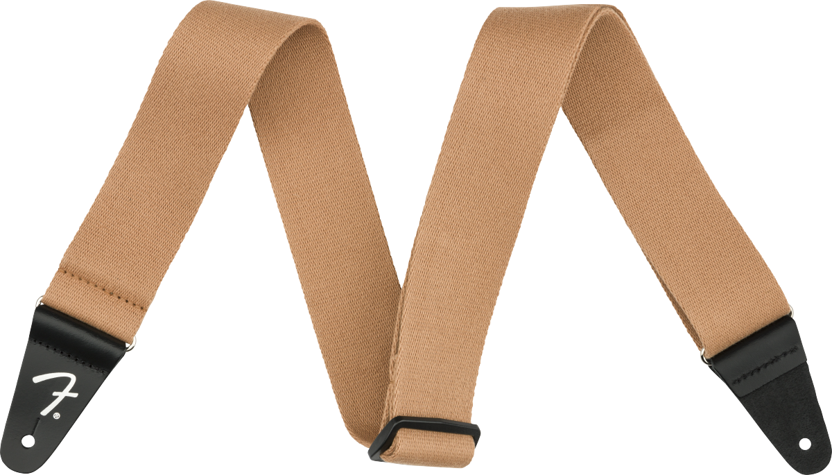 The image shows a tan/brown woven cotton or canvas guitar strap with black leather Fender-branded end tabs. It has an adjustable length and a classic, functional design. This essential accessory helps guitarists and bassists comfortably play while standing by distributing the instrument’s weight across the shoulder and torso, suitable for various musical styles and performance settings.
