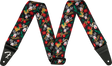 The image shows a Fender guitar strap with a black background featuring a festive pattern of red-nosed reindeer, red poinsettias, green holly leaves, white snowflakes, and gold Fender logos. It has black leather ends, one displaying the white Fender "F" logo, with holes for attaching to guitar strap pins. This seasonal accessory blends holiday designs with classic Fender branding.