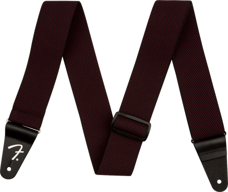 A dark red tweed guitar strap with Fender branding on a white background
