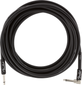 The image shows a black Fender instrument cable with 1/4-inch jack connectors: one straight and one right-angle. Commonly used to connect electric guitars, basses, keyboards, and other instruments to amps or pedals, the right-angle plug helps save space and reduce strain. Fender branding indicates a professional-grade cable designed to deliver clear audio with minimal noise, essential for musicians.