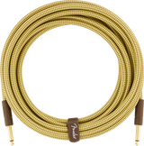 The image shows a high-quality Fender coiled guitar cable with gold-plated 1/4" plugs, a durable tweed-patterned woven fabric exterior, and a brown Fender-branded leather strap. Its vintage design echoes Fender’s 1950s amplifier covers. This premium cable is designed to prevent tangling and deliver reliable signal transmission, making it ideal for electric guitars, basses, and related gear.