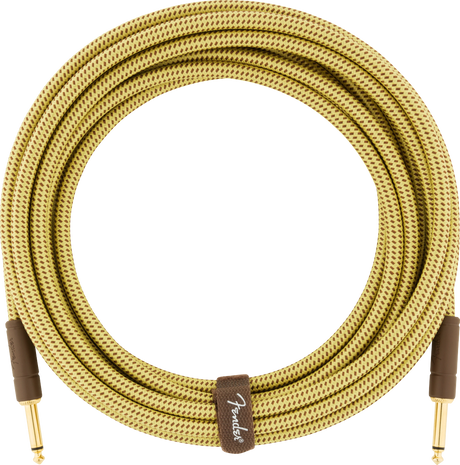 The image shows a high-quality Fender coiled guitar cable with gold-plated 1/4" plugs, a durable tweed-patterned woven fabric exterior, and a brown Fender-branded leather strap. Its vintage design echoes Fender’s 1950s amplifier covers. This premium cable is designed to prevent tangling and deliver reliable signal transmission, making it ideal for electric guitars, basses, and related gear.