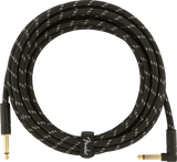 The image shows a high-quality instrument cable with a black braided exterior and white accents. It has gold-plated 1/4" TS connectors—one right-angle and one straight—for reduced strain. A Fender-branded cable tie secures it. The durable braided shielding minimizes interference, ensuring clear signal transmission. This premium cable is ideal for guitars, basses, and other electric instruments.