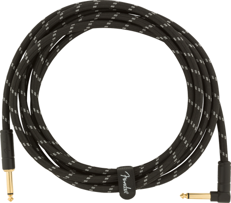 The image shows a coiled musical instrument cable with a black braided exterior featuring a white zigzag pattern. It has gold-plated 1/4" TS connectors—one straight and one right-angle. A cable tie with the "Fender" logo secures it. Designed for electric guitars, basses, and other instruments, the durable braided jacket and gold connectors ensure reliable performance and corrosion resistance.