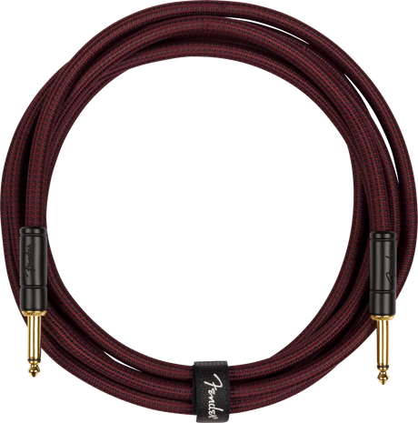 Coiled guitar cable with Fender logo on a white background
