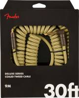 The image shows a Fender Deluxe Series Coiled Tweed guitar cable with a 9-meter (30 ft) coiled design and tweed fabric covering. It features 1/4" gold-colored plugs on both ends, providing flexibility and tangle resistance. The packaging displays the red Fender logo, indicating it’s an official accessory for connecting electric instruments to amps or audio gear, ideal for stage and studio use.