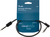 The image shows a Fender Blockchain Patch Cable, a 16" (0.41m) stereo TRS cable with one straight and one angled connector. It features 24 AWG oxygen-free copper conductors, 90% OFC spiral shielding, and a 4.1mm PVC jacket. The black cable has Fender branding on the connectors and comes in blue packaging. Designed for guitar pedals and audio gear, it’s ideal for compact pedalboards and studio setups.