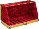 The image shows a multi-guitar display case with a deep red crushed velvet interior, gold/brass trim and hardware, and multiple neck slots holding 5-7 guitars. It has a hard shell exterior with professional latches and hinges. Designed for collectors, stores, or touring musicians, it offers secure, scratch-protective storage and an elegant, premium look ideal for transport and display.