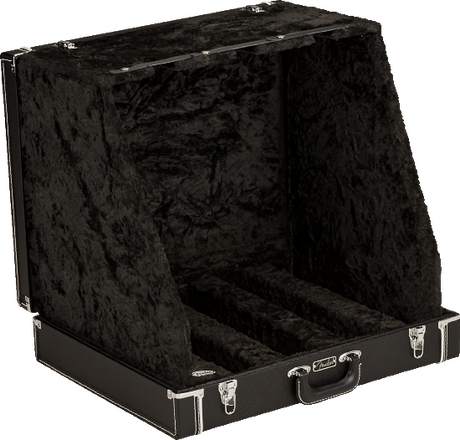 The image shows an open black hard-shell guitar case with a plush, velvet-like interior. It features metal corner reinforcements, latches, a side handle, and padded compartments designed to securely hold and separate multiple guitars. This professional-grade case is built for safe transport and protection of several instruments, commonly used by musicians, guitar techs, or collectors.