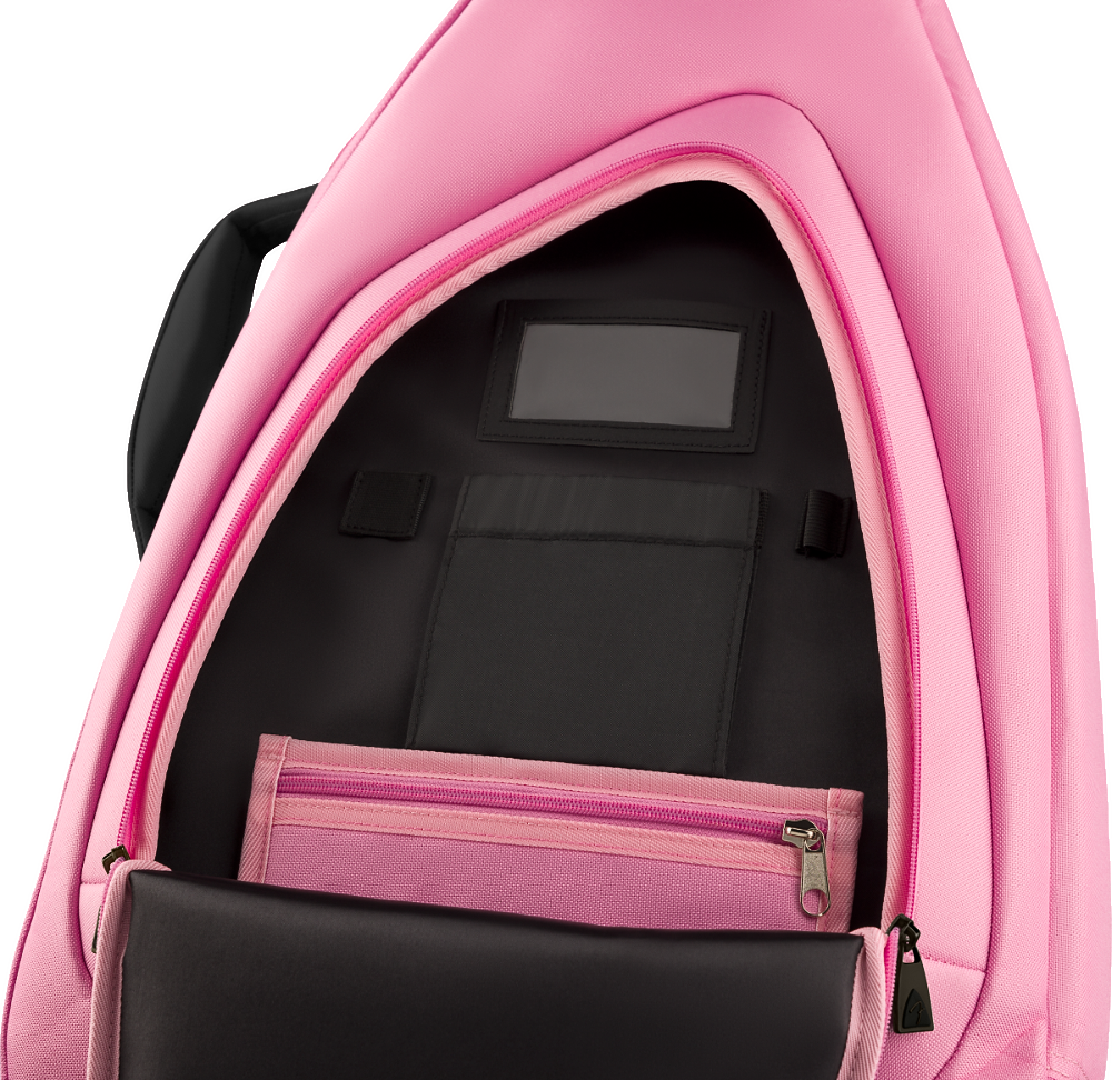 The image shows a pink musical instrument gig bag opened to reveal a black padded interior with compartments, pockets, a zippered section, and straps to secure an instrument. Designed for guitars, keyboards, or similar instruments, the well-constructed case offers protection and organization, making it ideal for musicians transporting their gear to performances, lessons, or recording sessions.