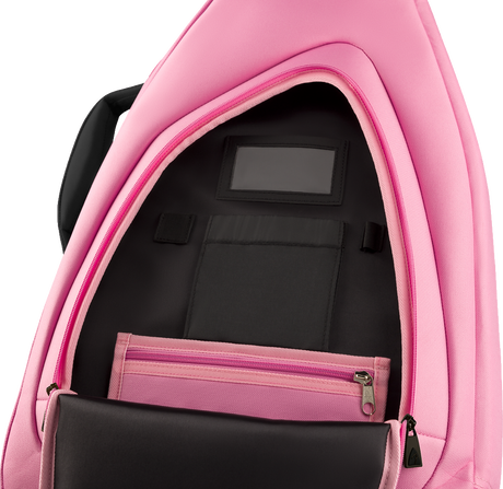 The image shows a pink musical instrument gig bag opened to reveal a black padded interior with compartments, pockets, a zippered section, and straps to secure an instrument. Designed for guitars, keyboards, or similar instruments, the well-constructed case offers protection and organization, making it ideal for musicians transporting their gear to performances, lessons, or recording sessions.