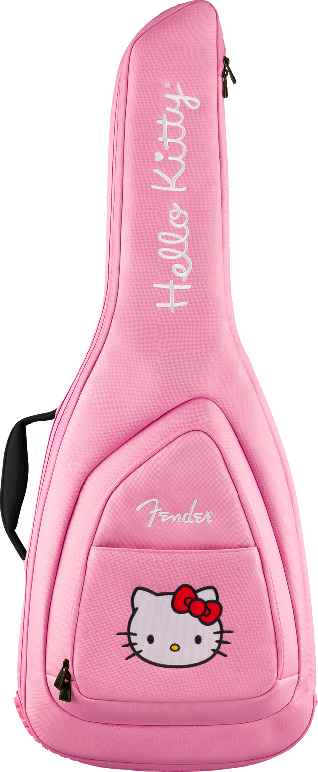 The image shows a bright pink Fender guitar gig bag with a Hello Kitty theme. It features white "Hello Kitty" text printed vertically, the Hello Kitty character with a red bow on the front pocket, padded construction, backpack-style straps, a front accessory pocket, and zipper closures. This official collaboration blends Fender guitar protection with Sanrio’s iconic character design.