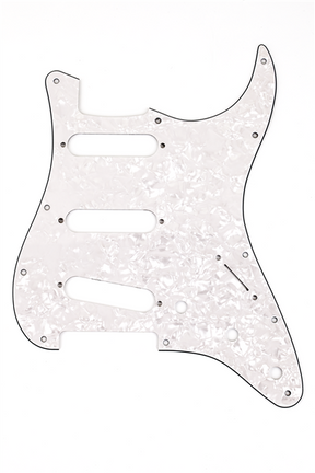 The image shows a Stratocaster-style guitar pickguard with a white pearl finish, featuring a classic shape with three single-coil pickup cavities, multiple screw holes, control cutouts, and the characteristic upper horn and lower bout. This aftermarket pickguard is designed for both protecting the guitar’s body and enhancing its appearance with a shimmering, pearloid look.