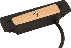 The image shows a soundhole pickup for acoustic guitars with a black plastic housing and a wood-grain top panel featuring a logo. Designed to fit into the soundhole, it converts string vibrations into electrical signals for amplification. Popular for live and recording use, it has an attached cable to connect to amps or audio equipment, blending natural acoustic tone with amplified sound.