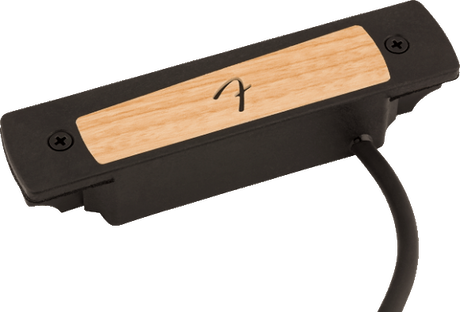 The image shows a soundhole pickup for acoustic guitars with a black plastic housing and a wood-grain top panel featuring a logo. Designed to fit into the soundhole, it converts string vibrations into electrical signals for amplification. Popular for live and recording use, it has an attached cable to connect to amps or audio equipment, blending natural acoustic tone with amplified sound.