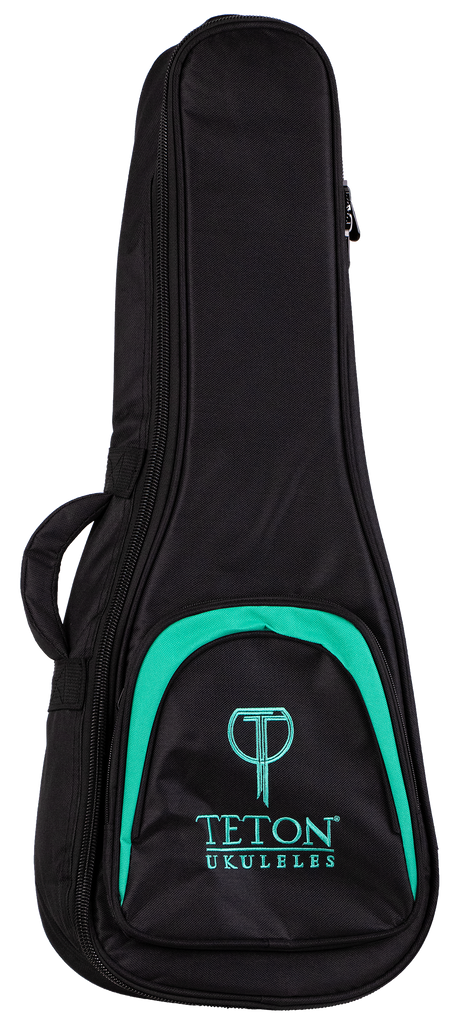 The image shows a Teton TBT12TL Tenor Ukulele Gig Bag, designed to protect and carry a tenor-sized ukulele. The bag features a black exterior with a front zippered pocket and padded shoulder straps for easy transport. It showcases the Teton logo and appears sturdy and well-padded, ideal for musicians seeking durable ukulele protection.