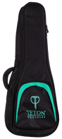 The image shows a Teton TBT12TL Tenor Ukulele Gig Bag, designed to protect and carry a tenor-sized ukulele. The bag features a black exterior with a front zippered pocket and padded shoulder straps for easy transport. It showcases the Teton logo and appears sturdy and well-padded, ideal for musicians seeking durable ukulele protection.