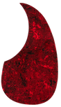 The image shows a guitar pickguard with a red tortoiseshell pattern in a classic teardrop shape typical of acoustic dreadnought guitars. Made from glossy, translucent celluloid or similar plastic, it features marbled red and black swirls. This decorative pickguard protects the guitar’s top from scratches while adding a bold, vintage-inspired look that contrasts strikingly with natural or dark wood finishes.