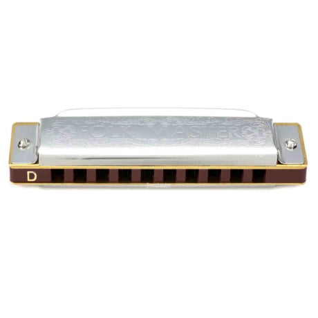 The image shows a 10-hole diatonic harmonica with a chrome top plate engraved with "GOLDEN," dark reddish-brown comb, and metal cover plates. The key of D is marked on the left side, and the harmonica features golden trim. This classic design is commonly used in blues, folk, country, and rock music.