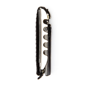 Black guitar toggle capo on a white background