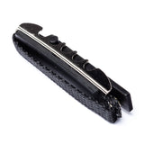 A black toggle guitar capo on a white background