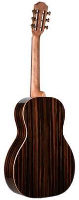 The image shows the back of a classical acoustic guitar with a polished wooden body featuring dark and light wood grain patterns. The lighter wood neck leads to a slotted headstock with visible tuning pegs, typical of classical guitars. This musical instrument belongs to the guitar family.