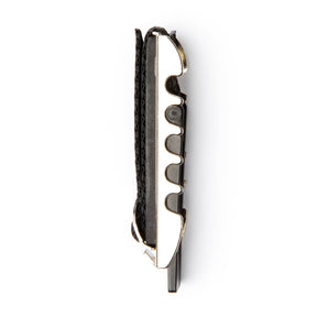 A toggle guitar capo on a white background