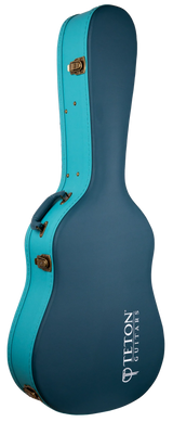 The image shows a Teton Guitars hard case for an acoustic guitar, featuring a two-tone dark teal body with bright turquoise trim and brass-colored latches. It has a classic guitar shape, reinforced edges, and "TETON GUITARS" branding in white. Designed with a hard shell for maximum protection, it’s ideal for safely transporting valuable instruments.