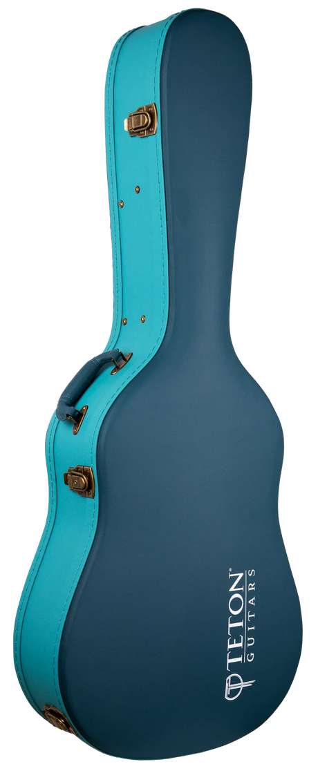 The image shows a Teton Guitars hard case for an acoustic guitar, featuring a two-tone dark teal body with bright turquoise trim and brass-colored latches. It has a classic guitar shape, reinforced edges, and "TETON GUITARS" branding in white. Designed with a hard shell for maximum protection, it’s ideal for safely transporting valuable instruments.