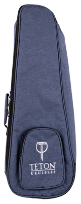 The image shows a Teton Music ukulele gig bag made of blue denim-textured fabric with a zippered edge and a small front pocket featuring the "TETON UKULELES" logo in white. Designed for concert or tenor ukuleles, this padded, soft-sided case offers lightweight protection during transport. It includes carrying handles and likely shoulder straps, making it a practical accessory for musicians on the go.
