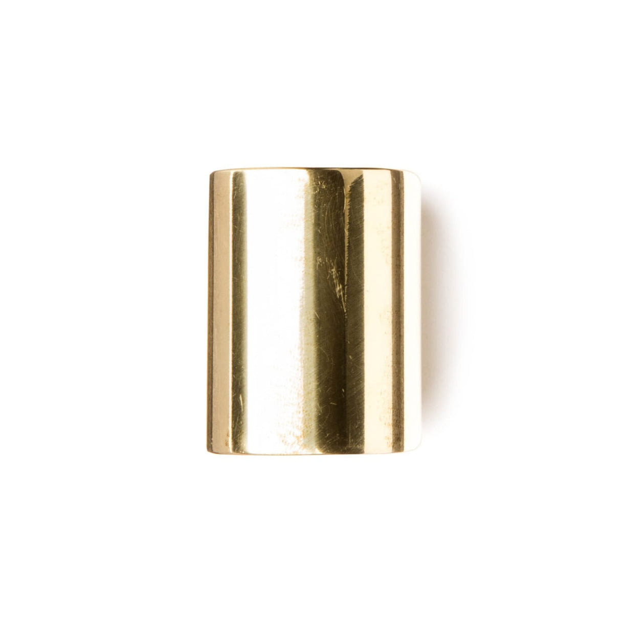 A short brass slide for guitar on a white background