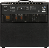 The image shows the back panel of an ACB 50 guitar amplifier. Visible features include the model label, power input, speaker outputs, input/output ports like balanced line out, safety labels, and ventilation grilles. The amp has a black textured cabinet, top handle, control knobs, and metal corner reinforcements. It's a mid-powered tube or hybrid amp suited for practice, recording, and small to medium venues.