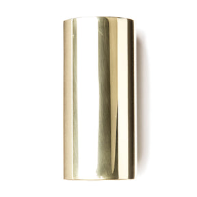 A brass slide for guitar on a white background