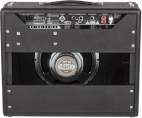 The image shows the back panel of a guitar combo amplifier featuring a Celestion "TEN 30" speaker, a control panel with knobs and input/output jacks, black tolex covering with metal corners, a top handle, and ventilation grilles. The design highlights its portability and all-in-one functionality, combining amplifier and speaker in a single unit, ideal for practice, recording, or small performances.