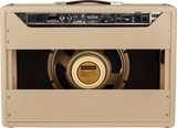 The image shows the back of a Fender Tone Master Deluxe Reverb guitar amplifier with blonde tolex, a leather handle, and a rear control panel featuring power, mute, and output switches. A 12-inch Celestion G12 NEO speaker with a gold cone is visible through the cabinet opening. The amp has traditional corner hardware, ventilation grilles, and a professional build, blending vintage Fender style with modern digital modeling technology.
