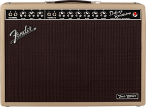 The image shows a Fender Deluxe Reverb guitar amplifier with a blonde tolex finish and dark brown grille. It features two channels—Normal and Vibrato—with Volume, Treble, and Bass controls. The Vibrato channel also has Reverb, Speed, and Intensity knobs. The black control panel includes input jacks, a red power light, a Fender logo, and a "Tone Master" badge. The amp is known for its warm tube tone, spring reverb, and classic Fender clean sound.