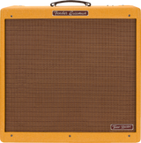 The image shows a Fender Bassman Tone Master guitar amplifier with a lacquered tweed finish, brown/bronze ribbed grill cloth, and a dark brown leather handle. The rectangular combo amp features the Fender logo on the front panel and a "Tone Master" badge on the lower right. This modern digital amp recreates the classic late 1950s Bassman sound, known for its iconic vintage tone popular in blues and rock music.