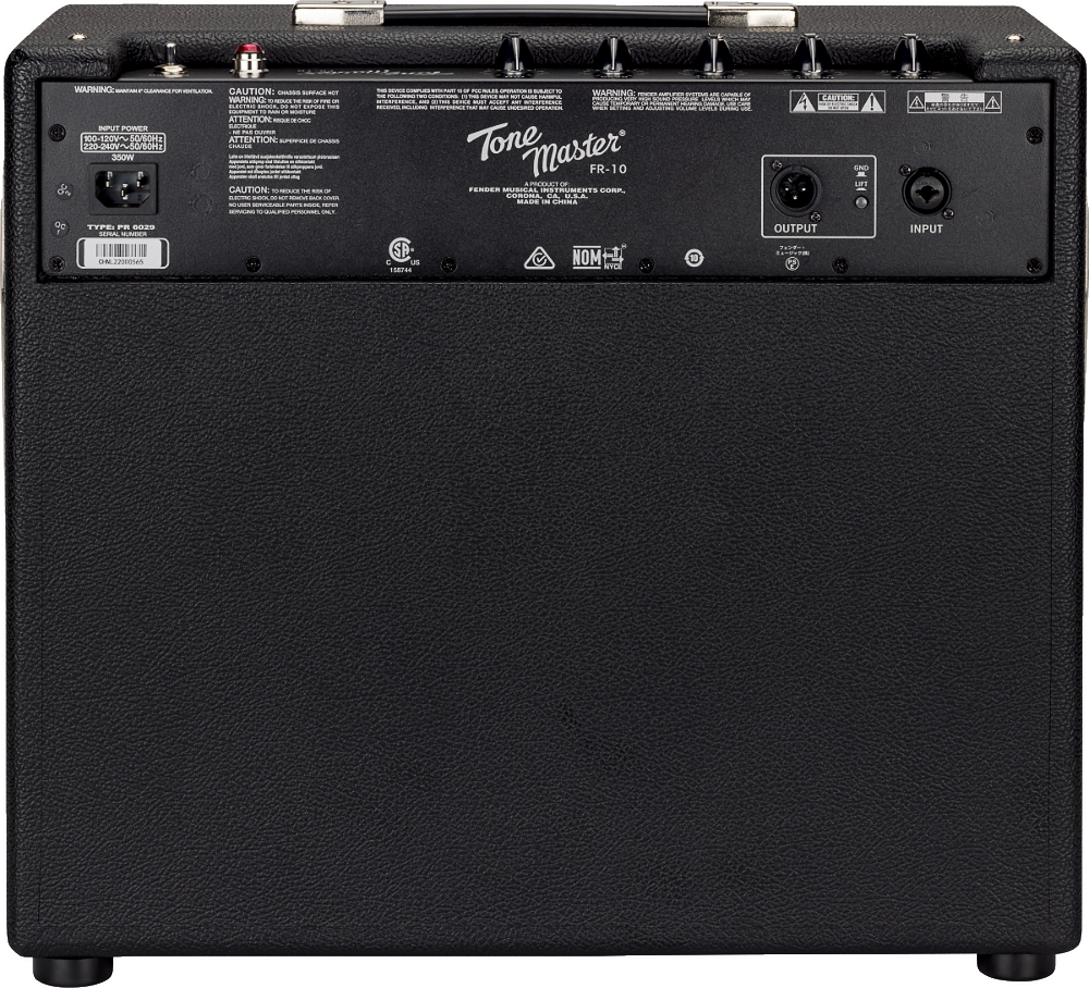 The image shows the back panel of a Fender Tone Master FR-110 digital modeling guitar amplifier. Visible features include the "Tone Master FR-110" branding, black textured vinyl covering, control knobs along the top edge, XLR input/output jacks on the right, an IEC power inlet on the left, warning labels, and safety certifications. The FR indicates a full-range flat response design for accurate sound with digital effects.