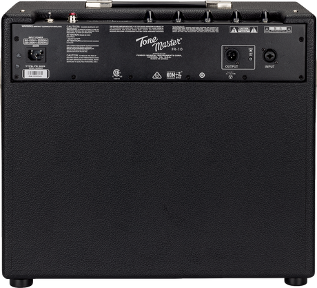 The image shows the back panel of a Fender Tone Master FR-110 digital modeling guitar amplifier. Visible features include the "Tone Master FR-110" branding, black textured vinyl covering, control knobs along the top edge, XLR input/output jacks on the right, an IEC power inlet on the left, warning labels, and safety certifications. The FR indicates a full-range flat response design for accurate sound with digital effects.