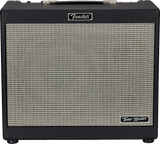 The image shows a Fender "Tone Master" combo guitar amplifier with a classic black tolex exterior and silver/cream grille cloth. It features the Fender logo at the top center, a carrying handle, and control knobs along the top edge. This modern amp blends traditional Fender design with digital modeling technology, making it a popular choice for electric guitarists.