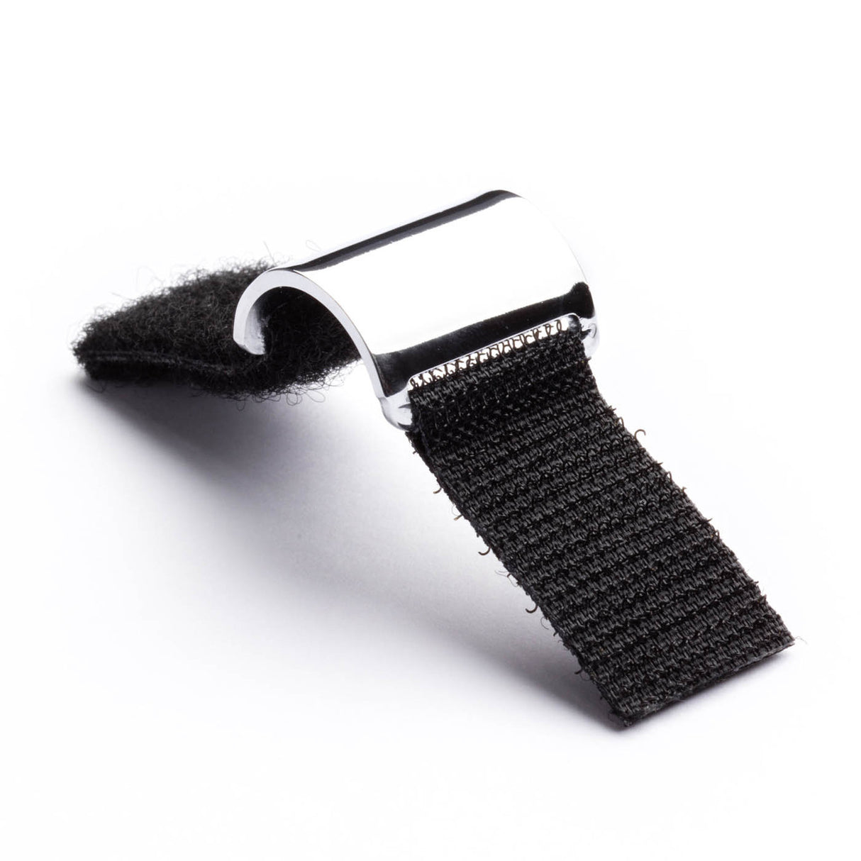 A short steel guitar slide with Velcro in an open position on a white background