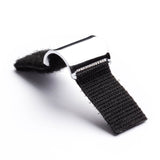 A short steel guitar slide with Velcro in an open position on a white background