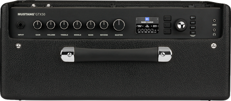 The image shows a Fender Mustang GTX50 digital modeling guitar amplifier. It features a control panel with knobs for input, gain, volume, treble, middle, bass, reverb, and master, a digital display showing the "BASIC CLEAN" preset, navigation buttons, and a data dial. The black textured cabinet includes metal corners, a handle, input/output jacks, and a 50-watt power rating.