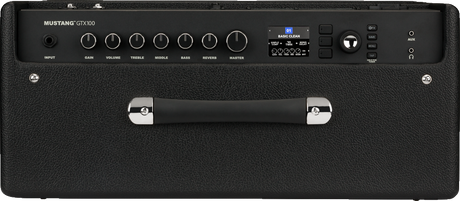 The image shows a Mustang GTX100 digital guitar amplifier with control knobs for Input, Gain, Volume, Treble, Middle, Bass, Reverb, and Master. It features a digital display, preset selection buttons, effects and modeling options, and an auxiliary input. The amp has black tolex covering with a sturdy handle. This 100-watt modeling amp simulates various classic amp sounds and built-in effects, suitable for practice and performance.