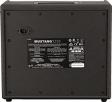 The image shows the back panel of a Fender Mustang LT25 guitar amplifier. It features a Fender logo and model label, a 25-watt power rating, an IEC power inlet, a specifications panel with technical details and safety warnings, the serial number in the bottom right, and ventilation screws around the edges. The panel lists input power (100-240V AC, 50/60Hz), certifications, and manufacturing info.