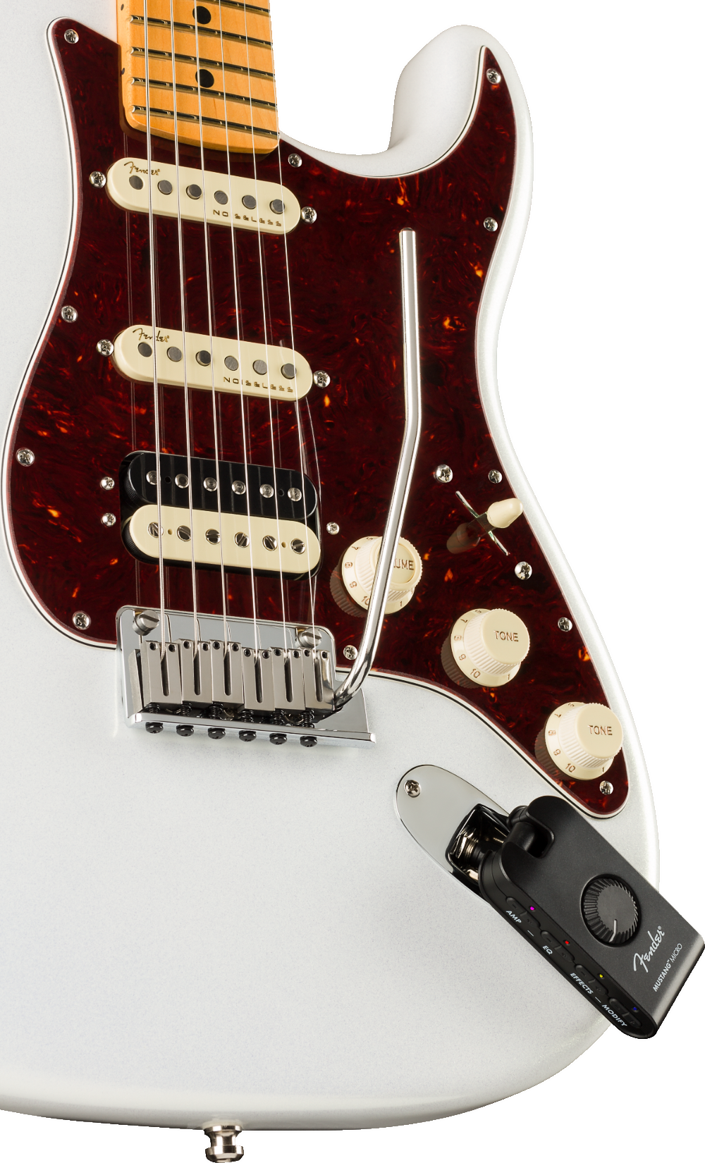 The image shows a Fender Stratocaster electric guitar with a white body, burgundy tortoiseshell pickguard, maple neck, and three single-coil pickups (two cream, one black). It features a chrome tremolo bridge, three control knobs, and standard Stratocaster electronics. Attached is a black Fender wireless transmitter, enabling cable-free play, blending classic design with modern wireless functionality for live performance.