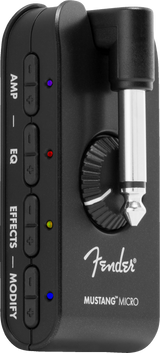 The image shows a Fender Mustang Micro, a compact black headphone guitar amplifier with control knobs labeled AMP, EQ, EFFECTS, and MODIFY, each with colored LED indicators. It features a guitar input jack on the right, a headphone output port, and the Fender logo. This portable device plugs directly into an electric guitar for silent practice with amp simulation and effects, ideal for quiet, on-the-go playing.
