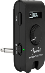 The image shows a Fender Mustang Micro Plus, a compact, portable headphone amplifier for electric guitars. It features a clip-on design, Fender branding, a display reading "1 DRIVEN DELUXE," a control knob, SAVE button, ON/OFF switch with green LED, and a 1/4" input jack. Ideal for silent practice, it offers amp simulations and effects in a small, convenient package.