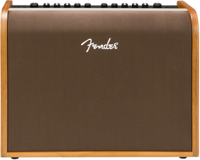 The image shows a Fender acoustic guitar amplifier with a wood-grain finish on the sides and a brown/bronze front grille. The white Fender logo is displayed on the front. Along the top edge are control knobs for volume and EQ. This medium-sized combo amp is designed to amplify acoustic guitars, delivering natural, warm sound, making it suitable for practice, small venues, or recording.