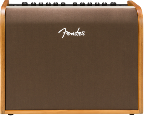 The image shows a Fender acoustic guitar amplifier with a wood-grain finish on the sides and a brown/bronze front grille. The white Fender logo is displayed on the front. Along the top edge are control knobs for volume and EQ. This medium-sized combo amp is designed to amplify acoustic guitars, delivering natural, warm sound, making it suitable for practice, small venues, or recording.